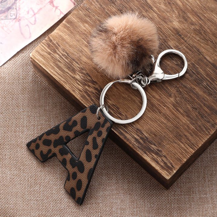 Western Style Leopard Print Letter Leather Keychain With Plush Ball - image 0