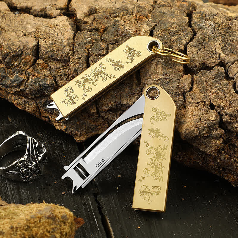 Compact Sleek Gold-Patterned Folding Brass Knife Keychain - image 0